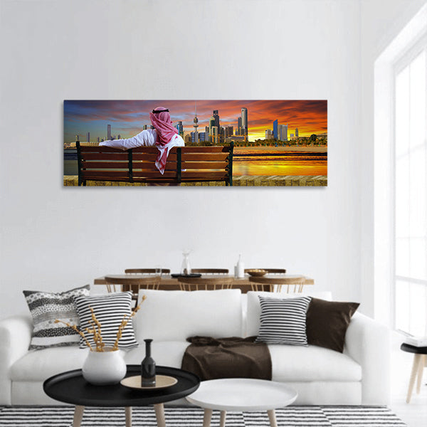 A man looking at the cityscape of Kuwait Panoramic Canvas Wall Art