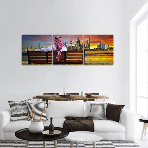A man looking at the cityscape of Kuwait Panoramic Canvas Wall Art