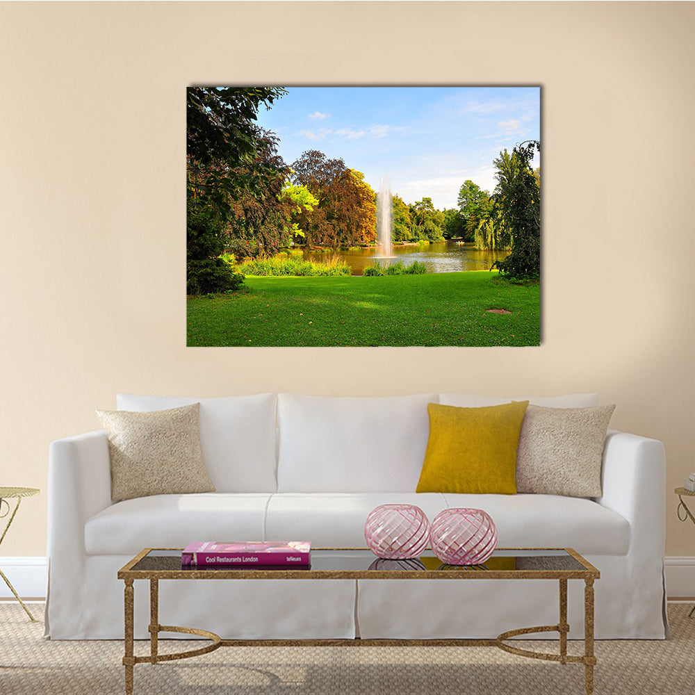 A shot of a fountain in Orangerie Park, Strasbourg, Alsace, France Multi Panel Canvas Wall Art