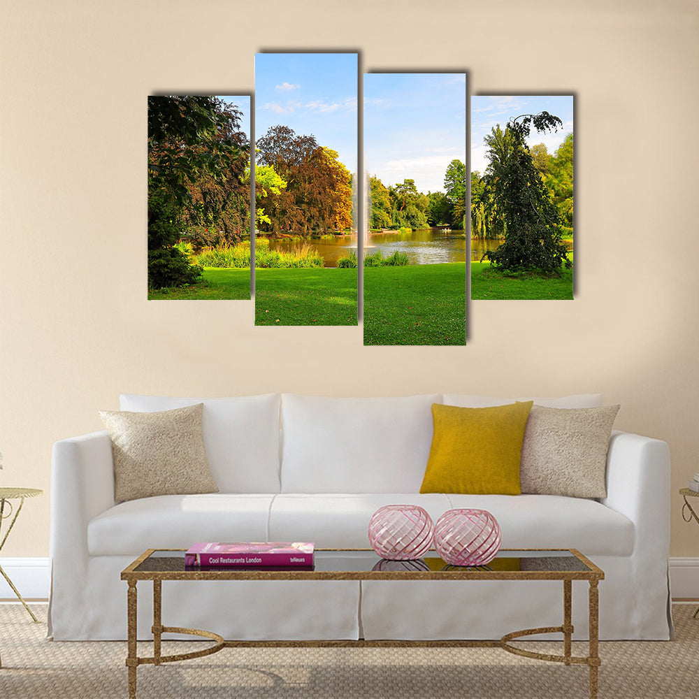 A shot of a fountain in Orangerie Park, Strasbourg, Alsace, France Multi Panel Canvas Wall Art