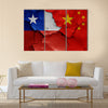 Flags of Chile and China painted on cracked wall Multi panel canvas wall art