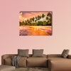 Beautiful tropical beach with palm trees at sunset Multi panel canvas wall art