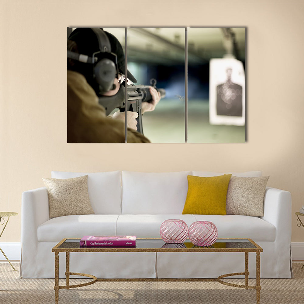 Man shooting machine gun at a target multi panel canvas wall art