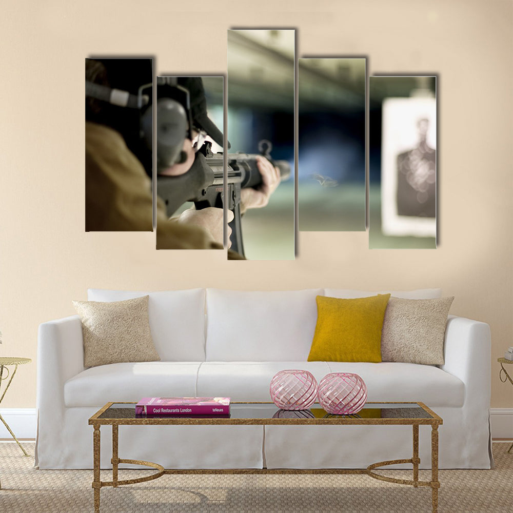 Man shooting machine gun at a target multi panel canvas wall art