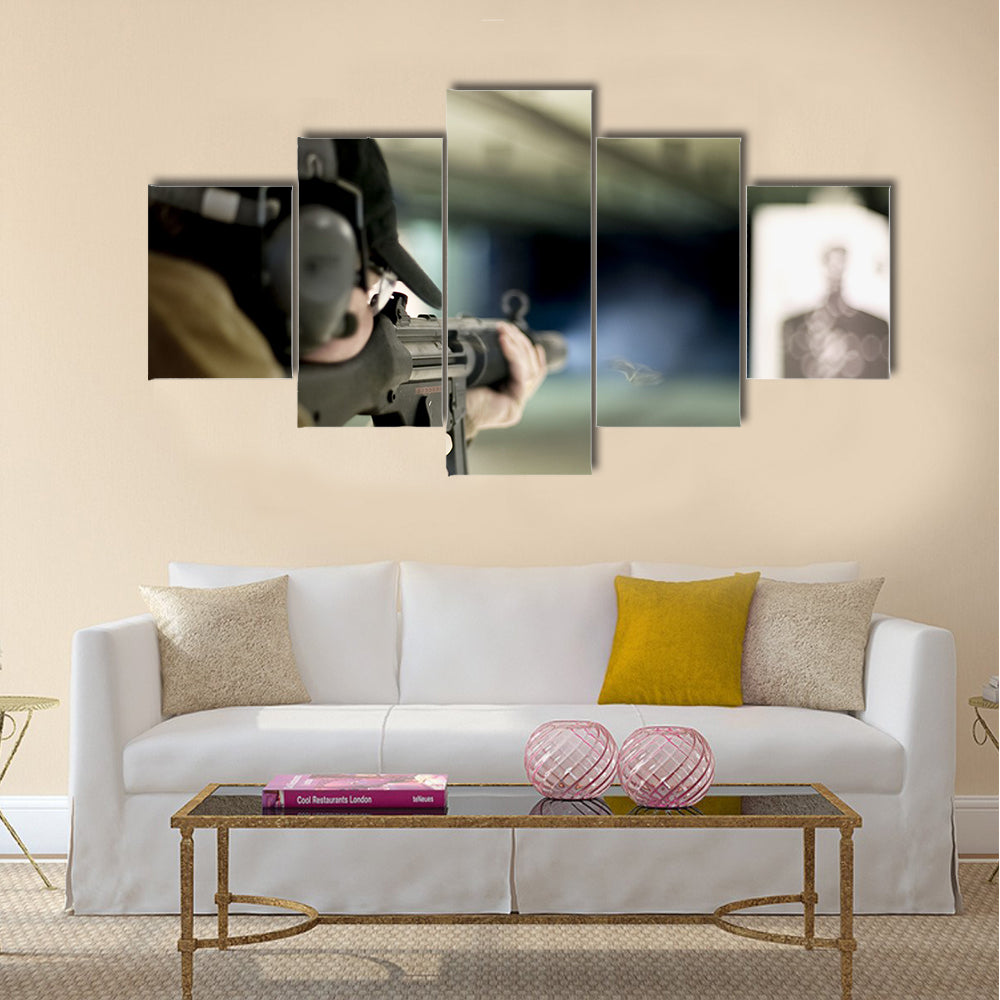 Man shooting machine gun at a target multi panel canvas wall art