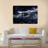 Lighthouse illuminated at night Multi Panel Canvas Wall Art