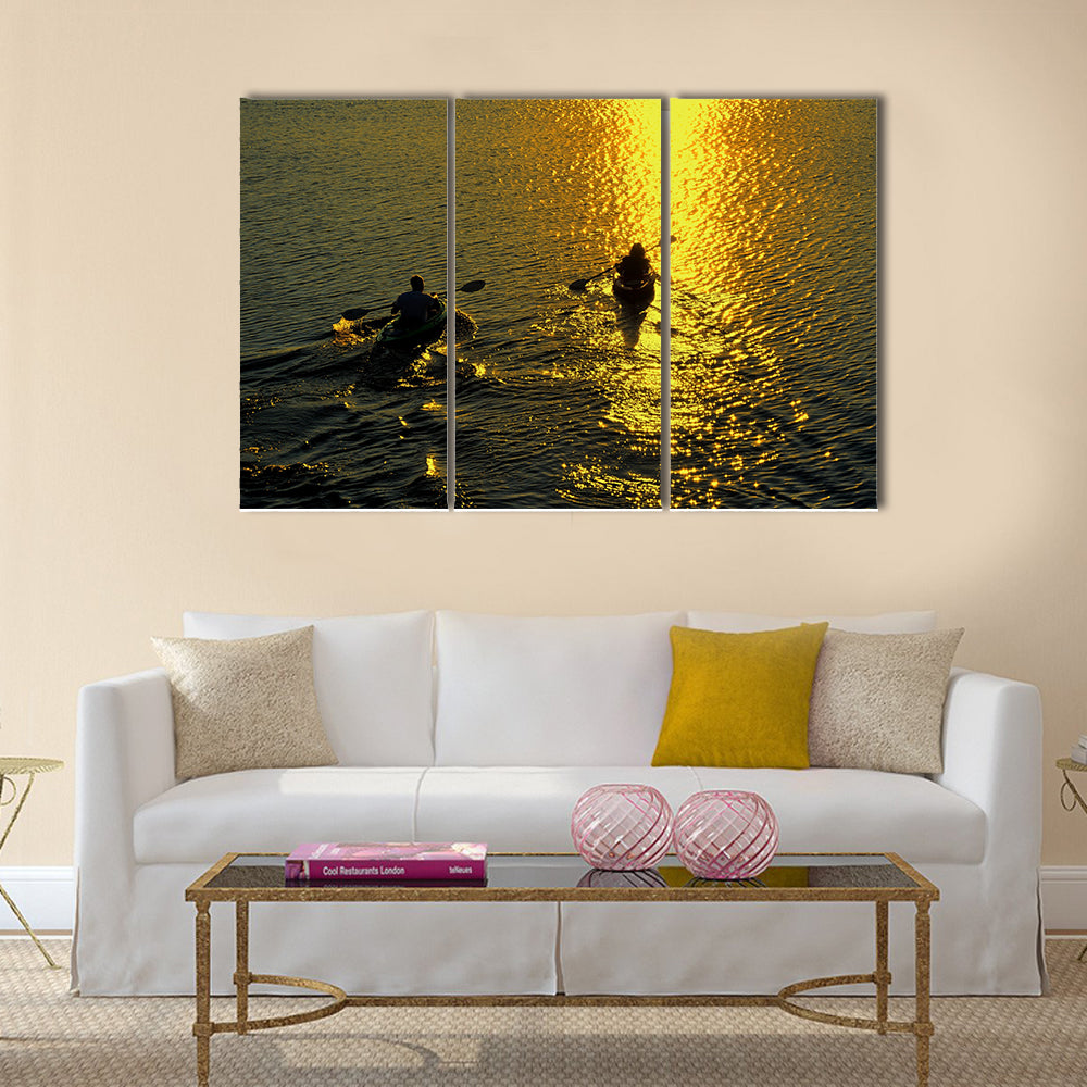 Silhouette of Man and Woman Kayaking at Sunset Multi panel canvas wall art