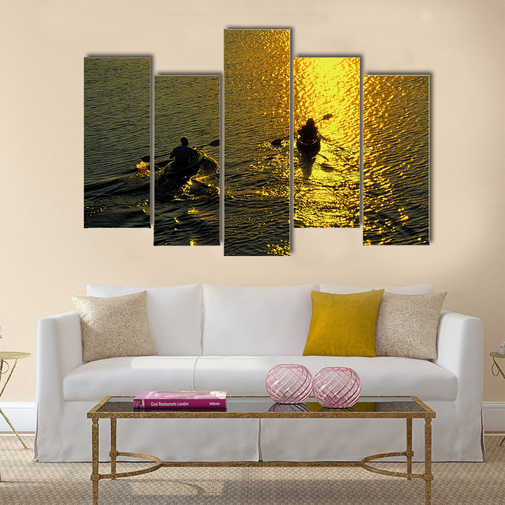 Silhouette of Man and Woman Kayaking at Sunset Multi panel canvas wall art
