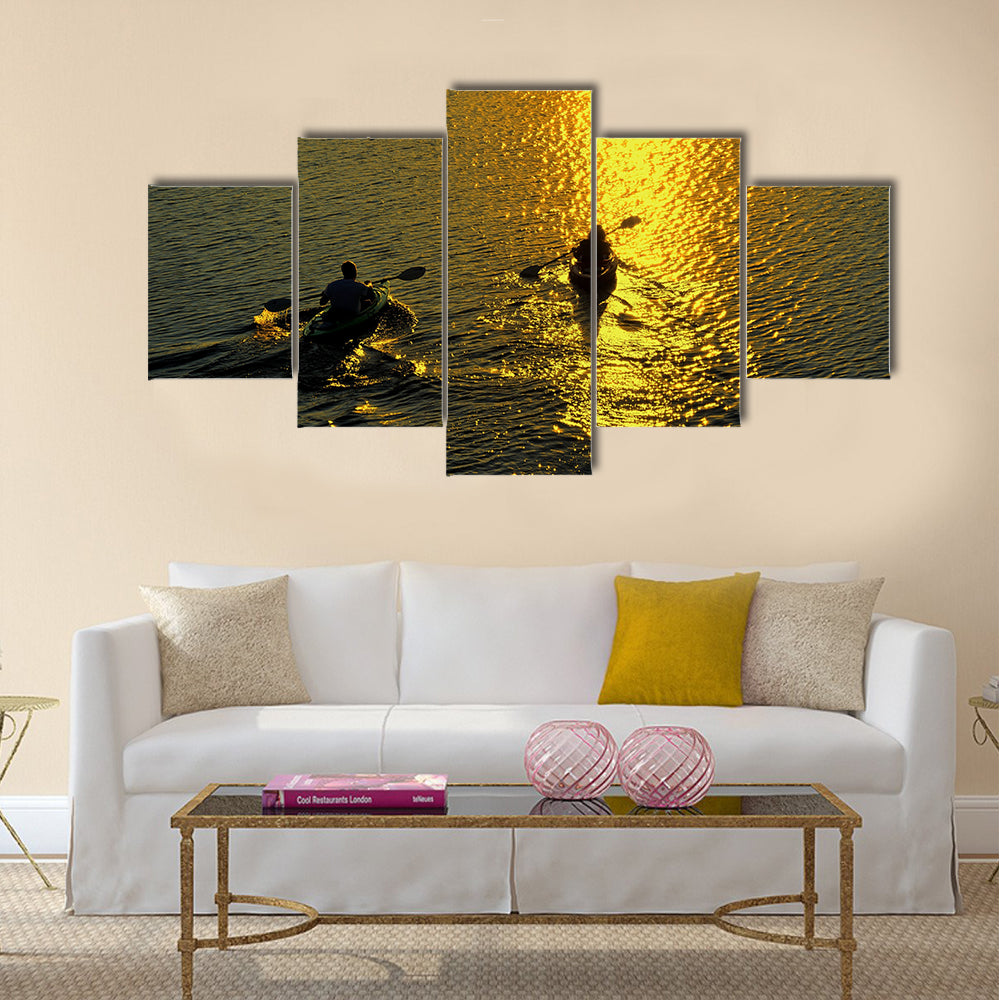 Silhouette of Man and Woman Kayaking at Sunset Multi panel canvas wall art