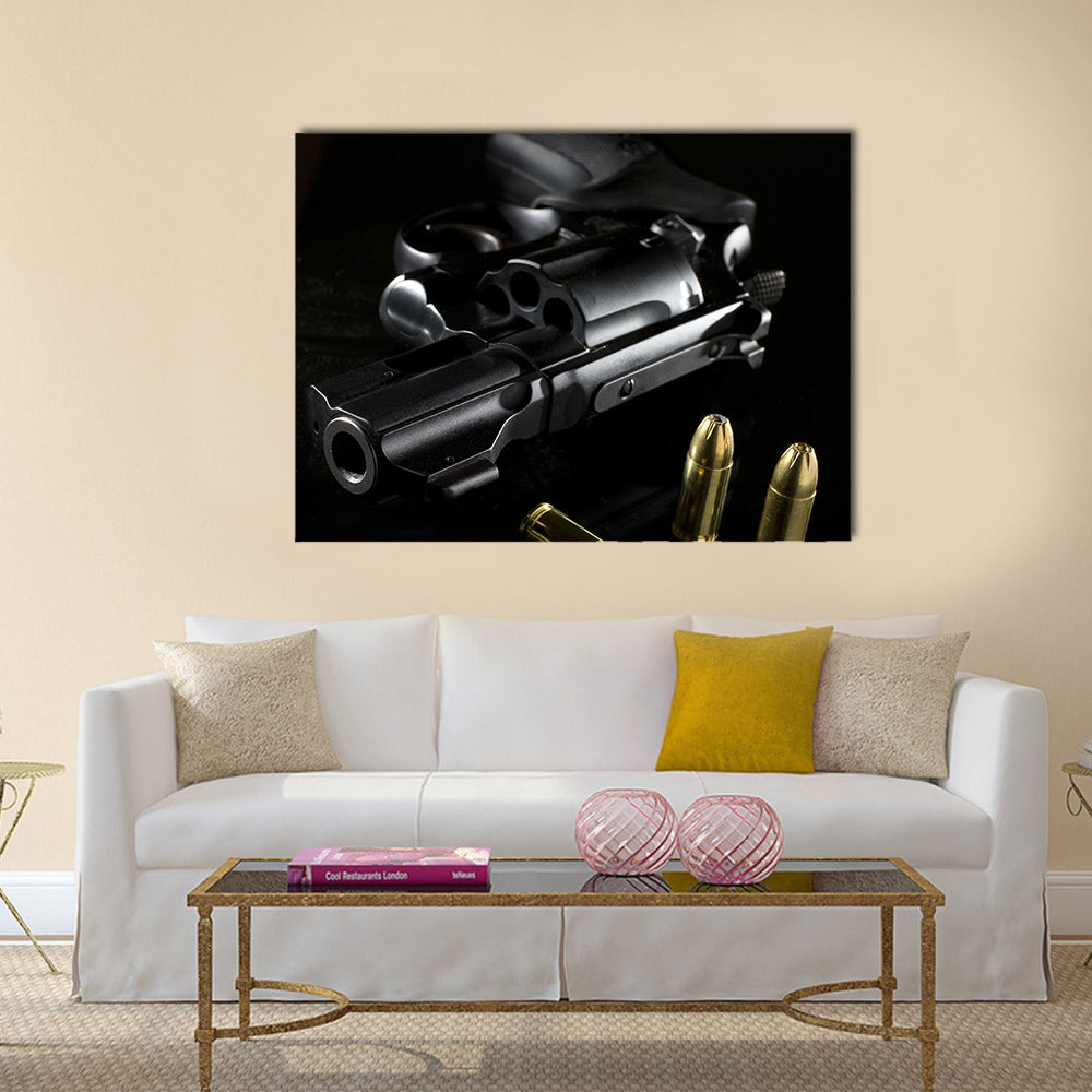 black revolver that is on a glass table  multi panel canvas wall art