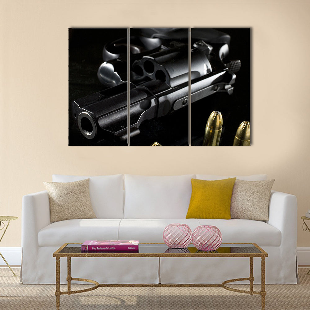 black revolver that is on a glass table  multi panel canvas wall art