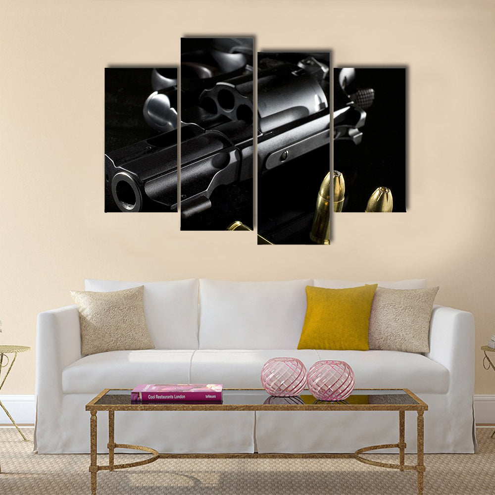 black revolver that is on a glass table  multi panel canvas wall art