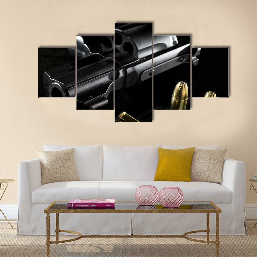 black revolver that is on a glass table  multi panel canvas wall art