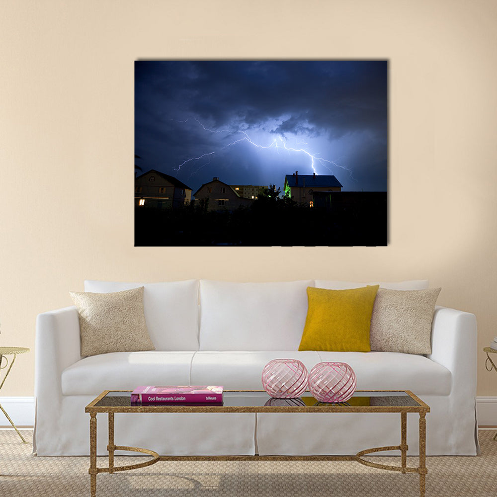Lightning in the cloudy storm sky over village Multi Panel Canvas Wall Art