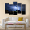 Lightning in the cloudy storm sky over village Multi Panel Canvas Wall Art