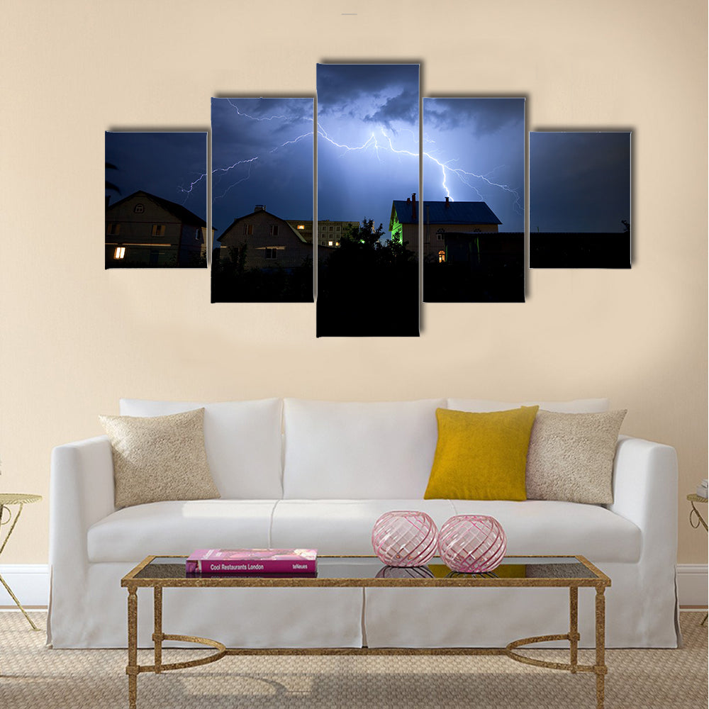 Lightning in the cloudy storm sky over village Multi Panel Canvas Wall Art
