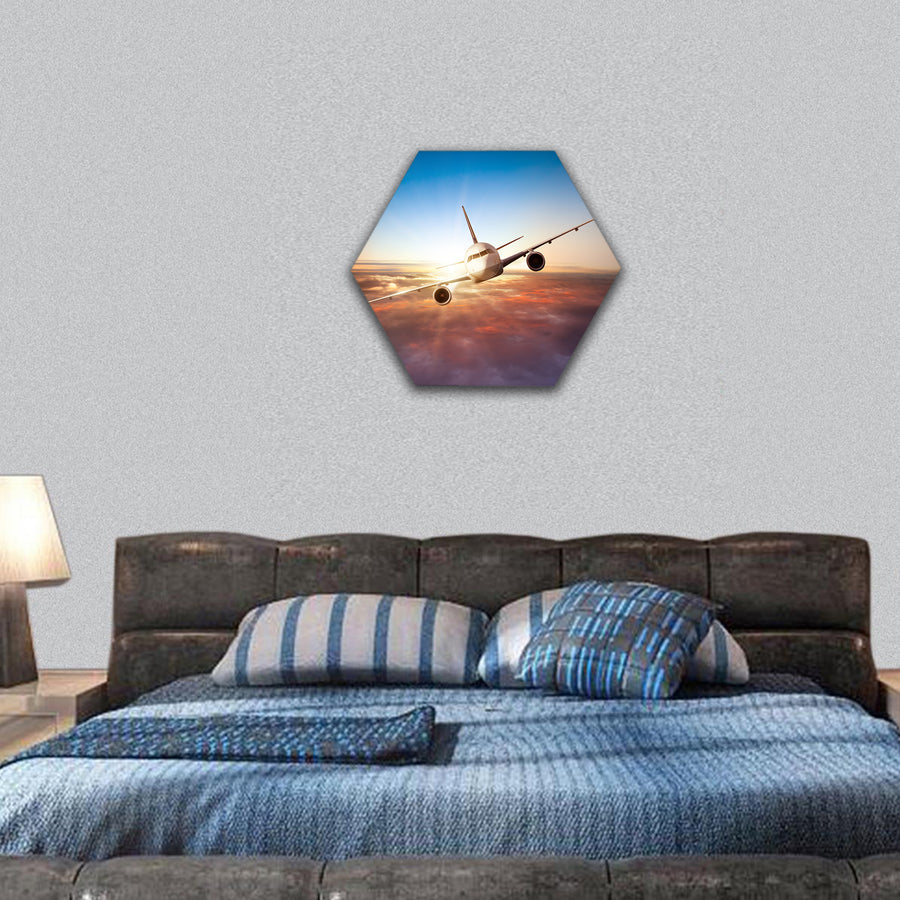 airplane flying above clouds in dramatic sunset light hexagonal canvas wall art