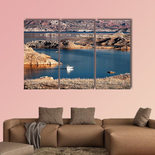 A white motorboat cruising through a channel in Lake Mead multi panel canvas wall art
