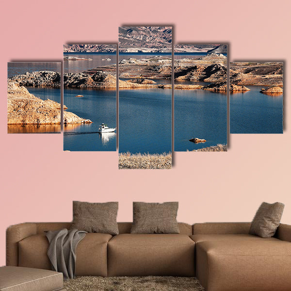 A white motorboat cruising through a channel in Lake Mead multi panel canvas wall art