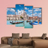 Beautiful view of traditional Gondolas on Canal Grande with historic wall art