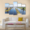 Traditional windmills at Kinderdijk in the Netherlands Multi panel canvas wall art