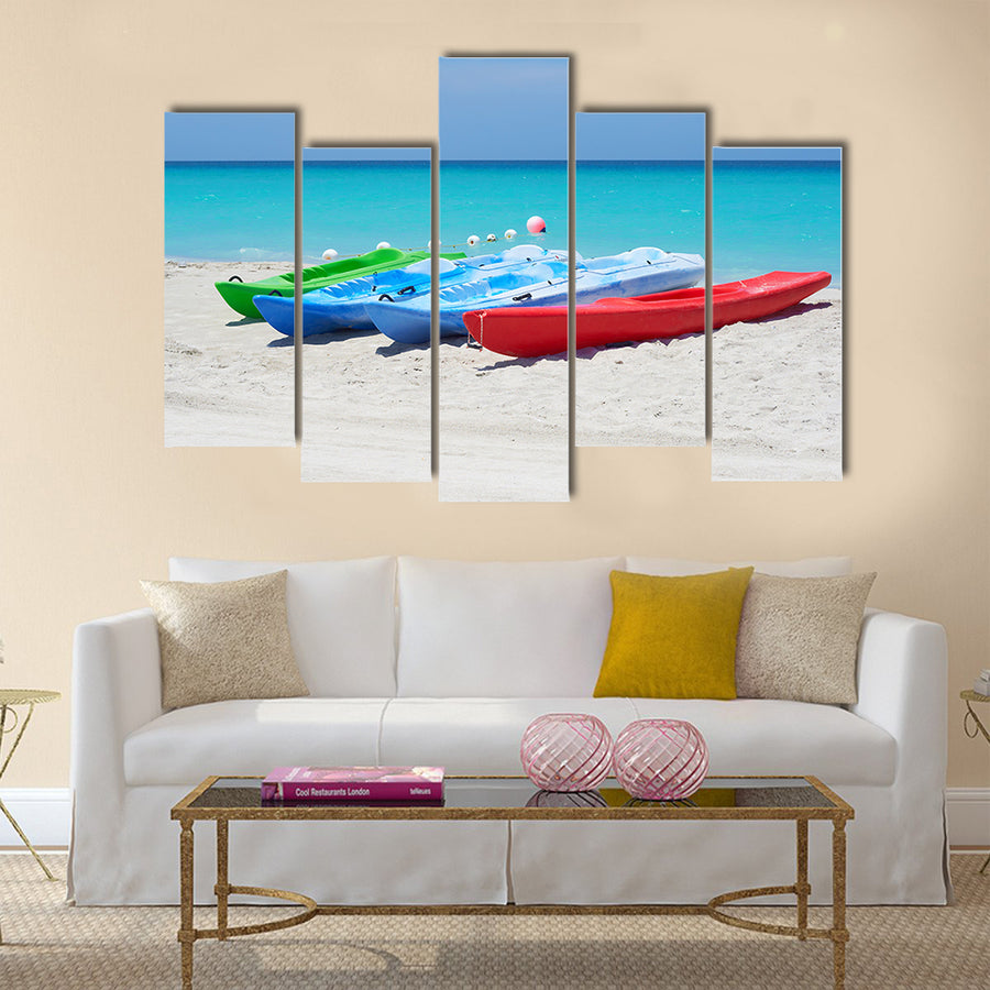 Group of kayaks ready to be rented in a beach Multi panel canvas wall art