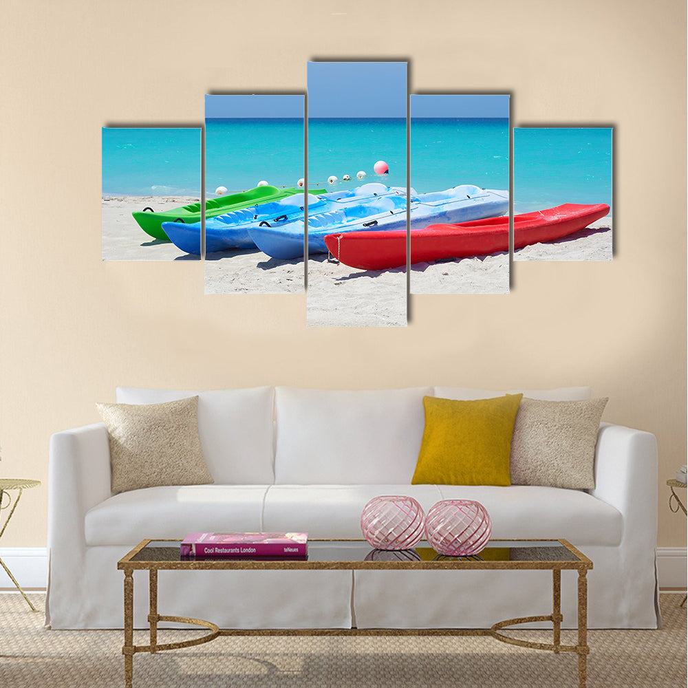 Group of kayaks ready to be rented in a beach Multi panel canvas wall art