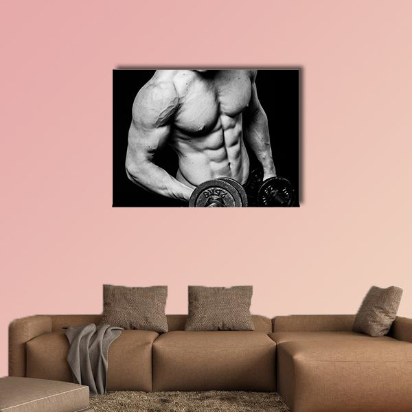 Young strong athlete on dark background isolated Multi panel canvas wall art