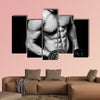 Young strong athlete on dark background isolated Multi panel canvas wall art