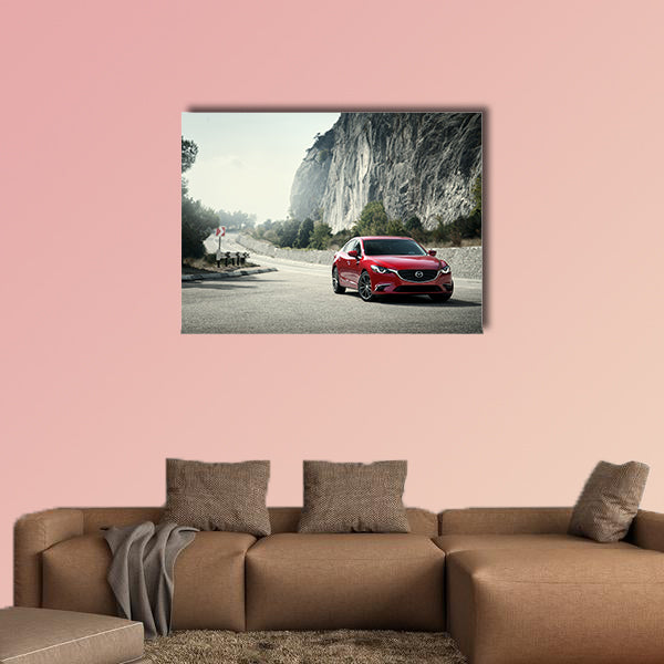 Red car Mazda standing on the road near mountains at daytime wall art