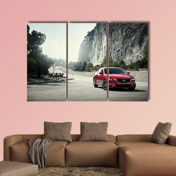 Red car Mazda standing on the road near mountains at daytime wall art