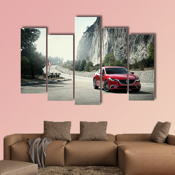 Red car Mazda standing on the road near mountains at daytime wall art