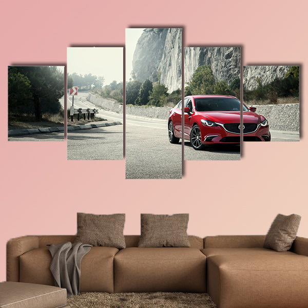 Red car Mazda standing on the road near mountains at daytime wall art