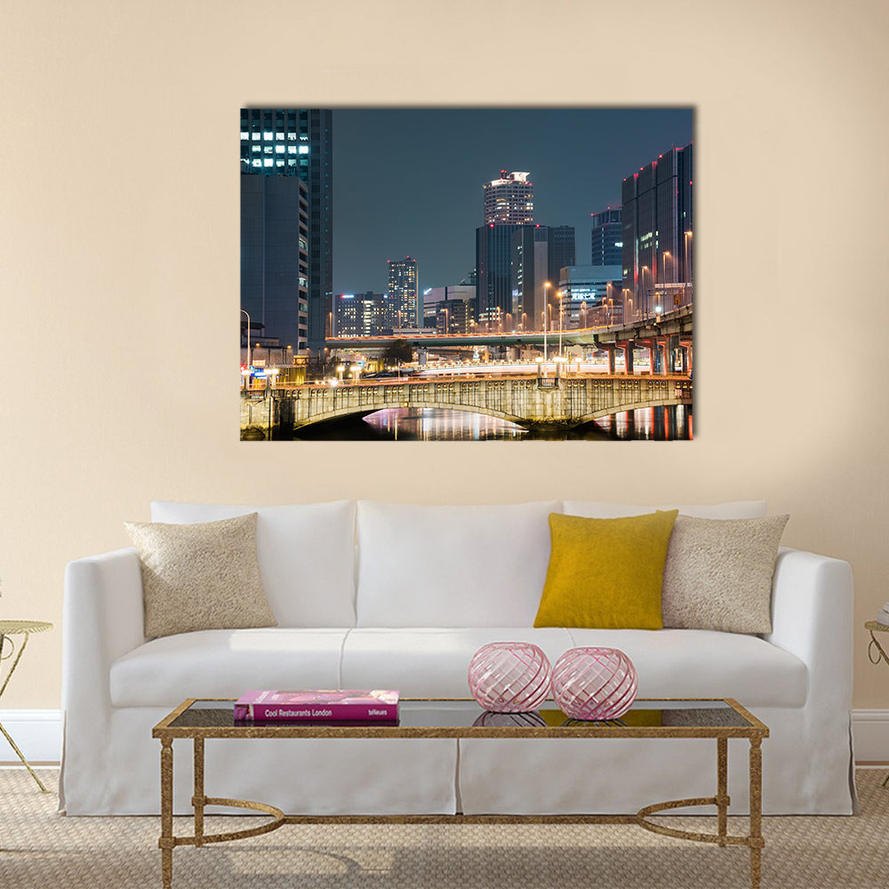 Bridges and buildings at night in downtown Osaka multi panel canvas wall art