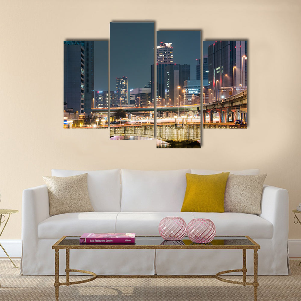 Bridges and buildings at night in downtown Osaka multi panel canvas wall art