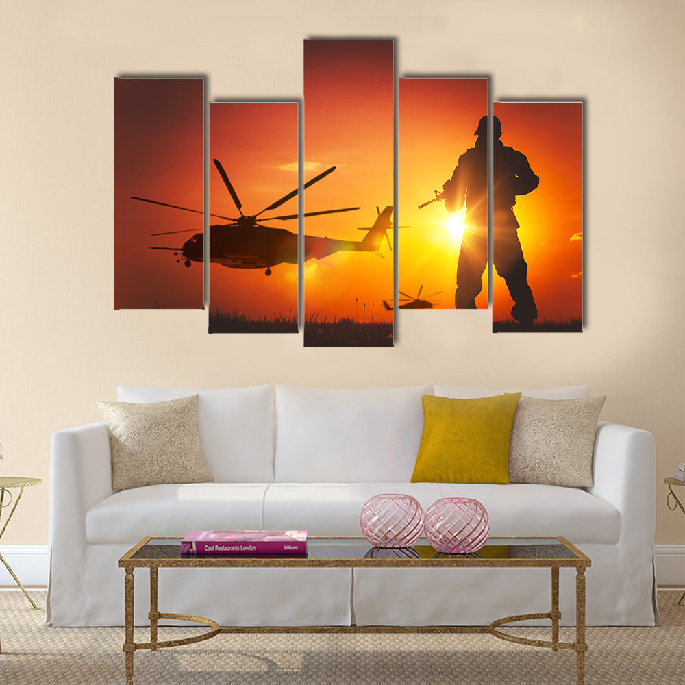 Military Mission at Sunset. Marines Helicopters Air Mission. Soldier with Assault Rifle Cover the Area Multi Panel Canvas Wall Art
