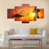 Military Mission at Sunset. Marines Helicopters Air Mission. Soldier with Assault Rifle Cover the Area Multi Panel Canvas Wall Art