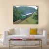 Passenger train passing through polish countryside Multi panel canvas wall art