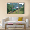 Passenger train passing through polish countryside Multi panel canvas wall art