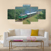 Passenger train passing through polish countryside Multi panel canvas wall art