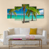 Three palm trees over blue lagoon in Fiji Islands multi panel canvas wall art