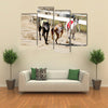 Sprinting Dynamic Greyhounds On The Race Course Multi Panel Canvas Wall Art