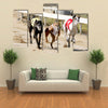 Sprinting Dynamic Greyhounds On The Race Course Multi Panel Canvas Wall Art