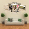 Sprinting Dynamic Greyhounds On The Race Course Multi Panel Canvas Wall Art