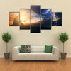 A Man Praying In Front Of The God In A Windy Storm And The Sunrise Multi Panel Canvas Wall Art