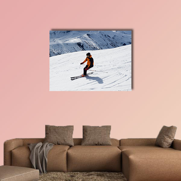 Skier turning down the mountain Multi panel canvas wall art