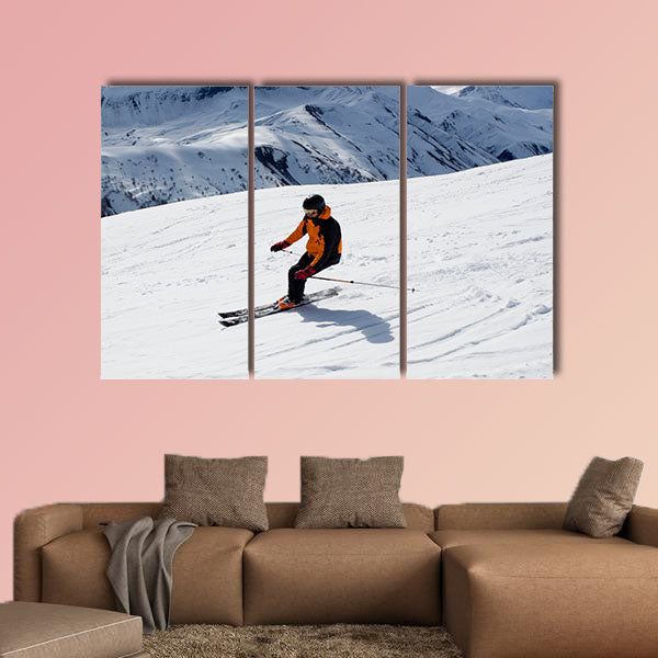 Skier turning down the mountain Multi panel canvas wall art