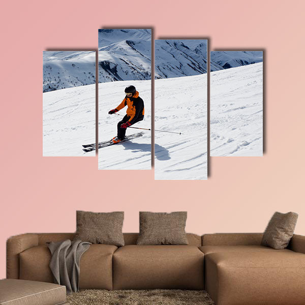 Skier turning down the mountain Multi panel canvas wall art