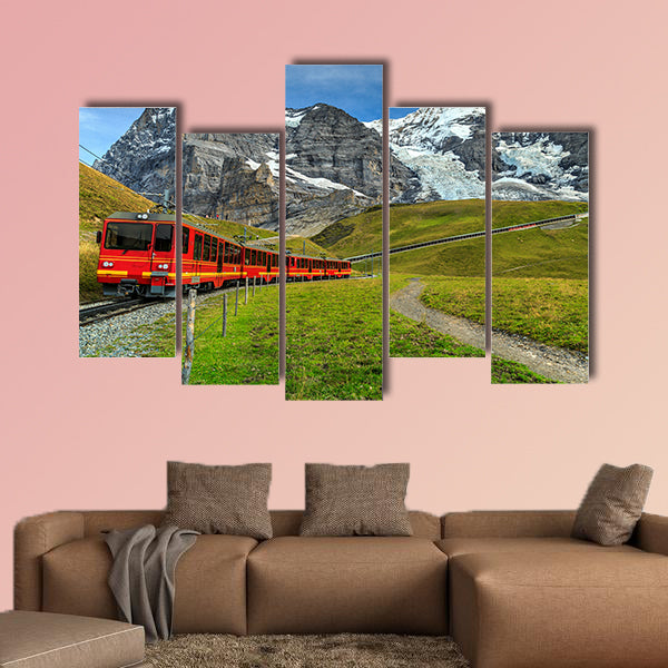 Famous electric red tourist train coming down in Kleine canvas wall art
