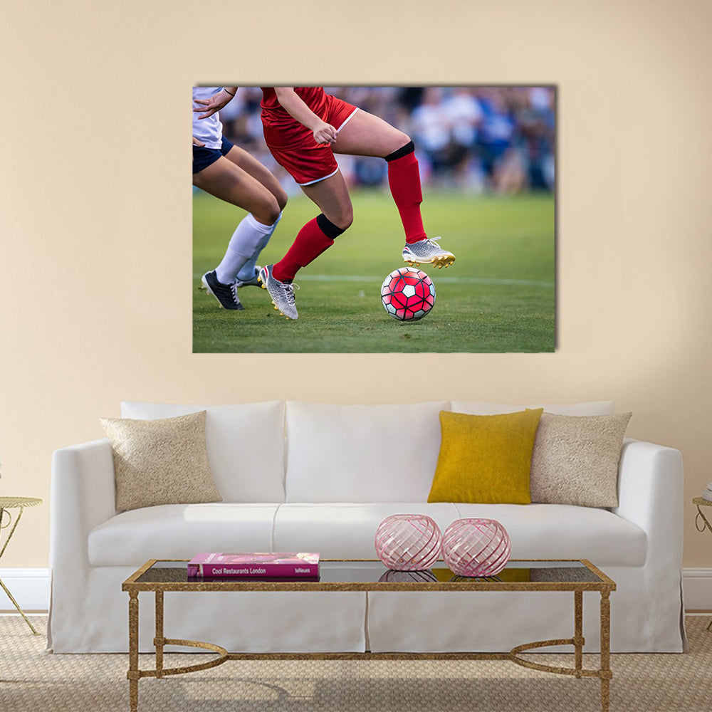 Women playing in a soccer game on a soccer field Multi panel canvas wall art